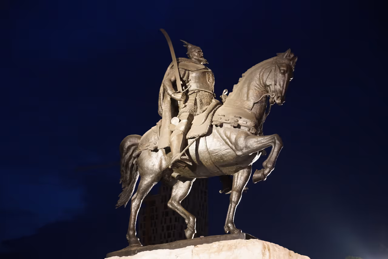 Skanderbeg monument at sunset in Tirana