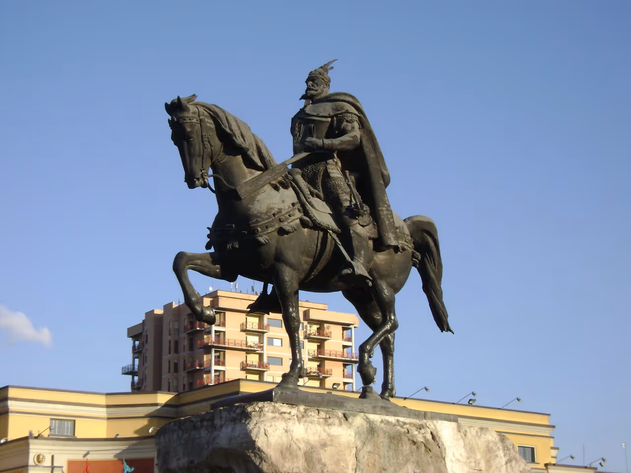 Skanderbeg monument at sunset in Tirana