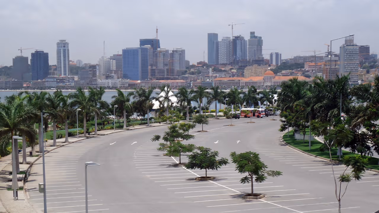 Walk the marginal promenade in Luanda
