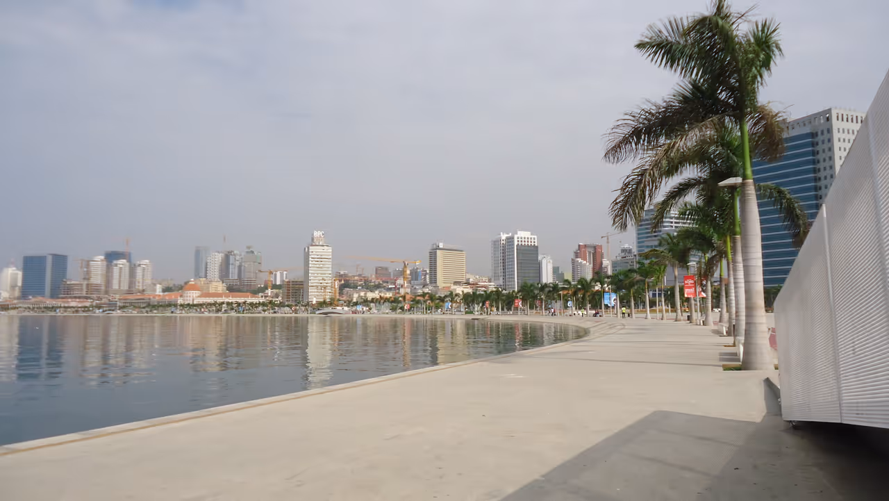 Walk the marginal promenade in Luanda