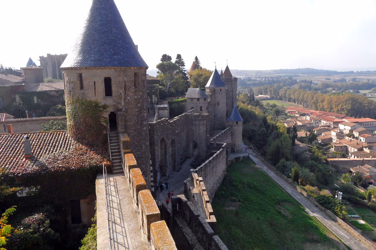 Panoramic view of the medieval fortifications of Carcassonne showing stone towers and ramparts