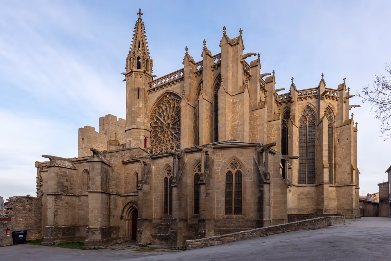 Exterior of the Gothic and Romanesque Basilica of Saints Nazarius and Celsus in Carcassonne with its large rose window and stone flying buttresses