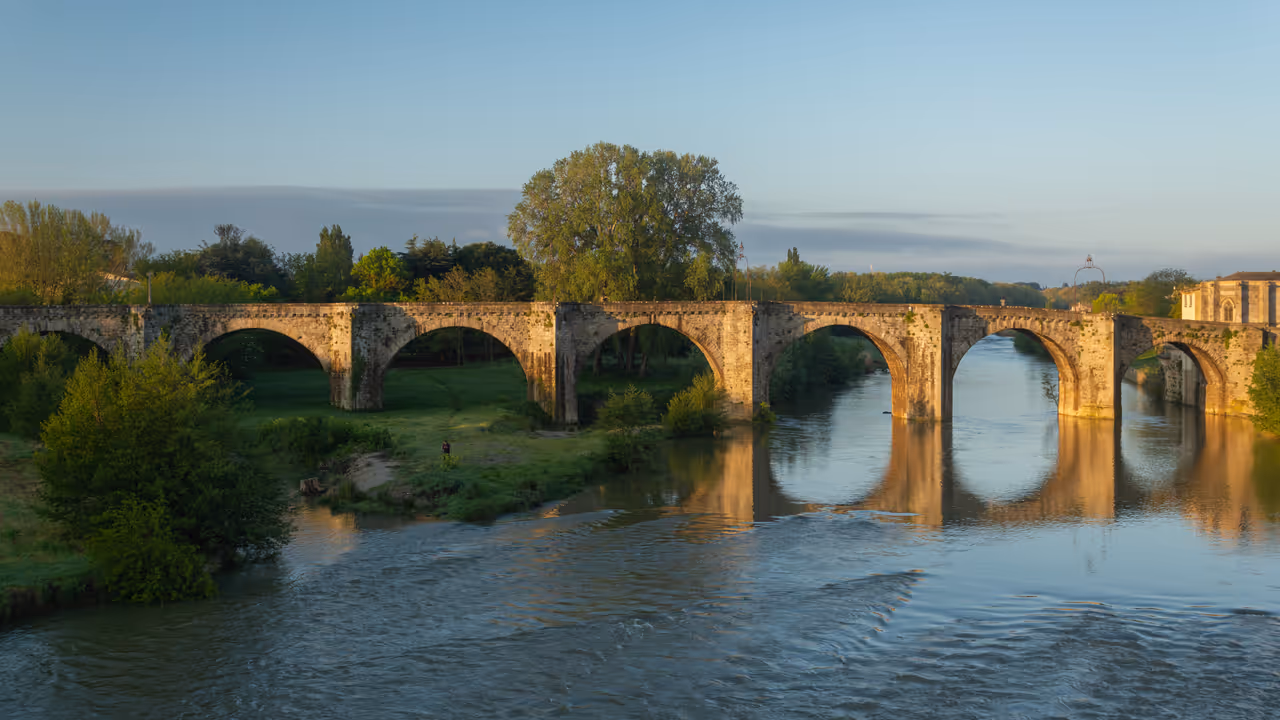 Scenic view of the historic Pont-Vieux medieval stone arch bridge crossing the Aude river