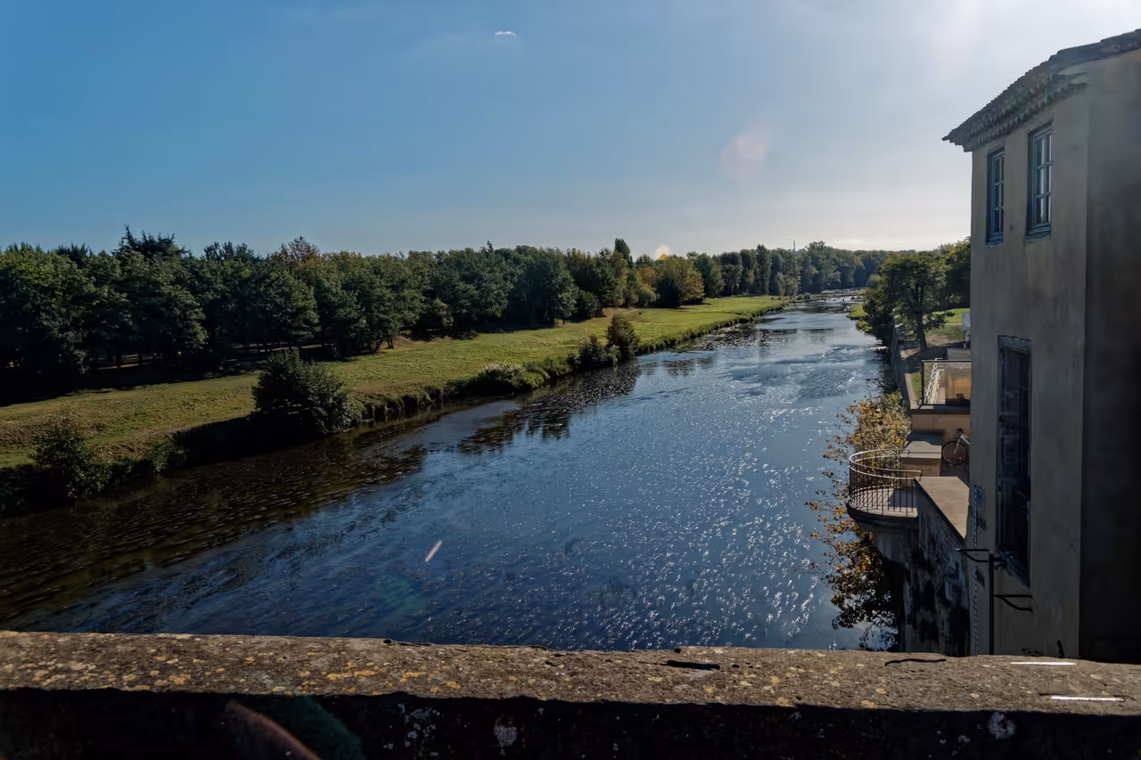 Scenic view of the River Aude from the Old Bridge in Carcassonne on a sunny day