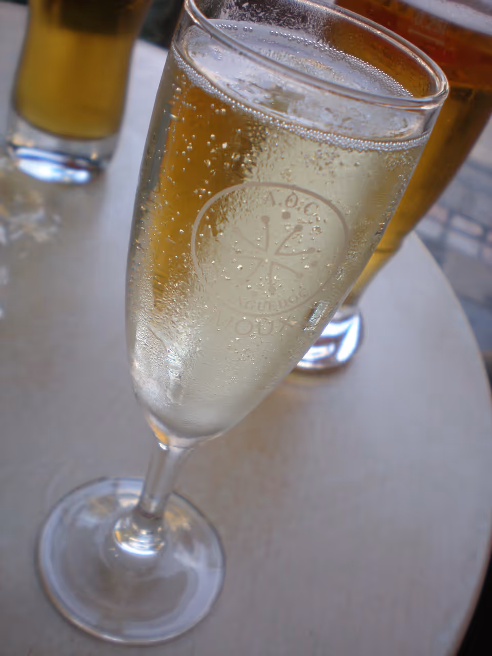 Glass of Blanquette de Limoux sparkling wine in an etched champagne flute