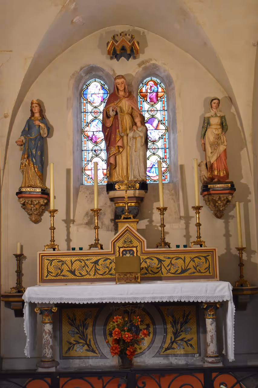 Altar and stained glass windows inside the Church of Saint-Gimer in Carcassonne