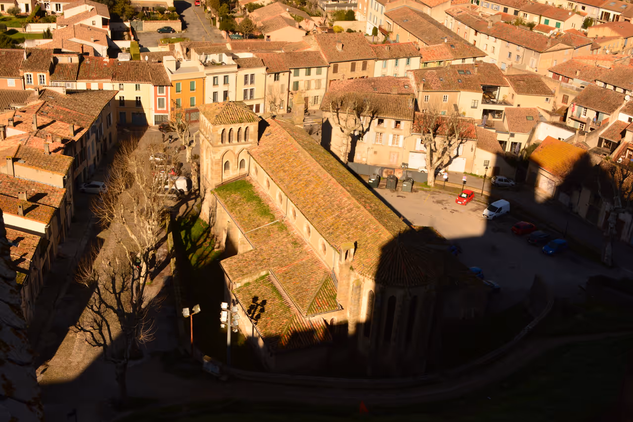 Aerial view of Église Saint-Gimer church and surrounding town buildings from the Château de Carcassonne