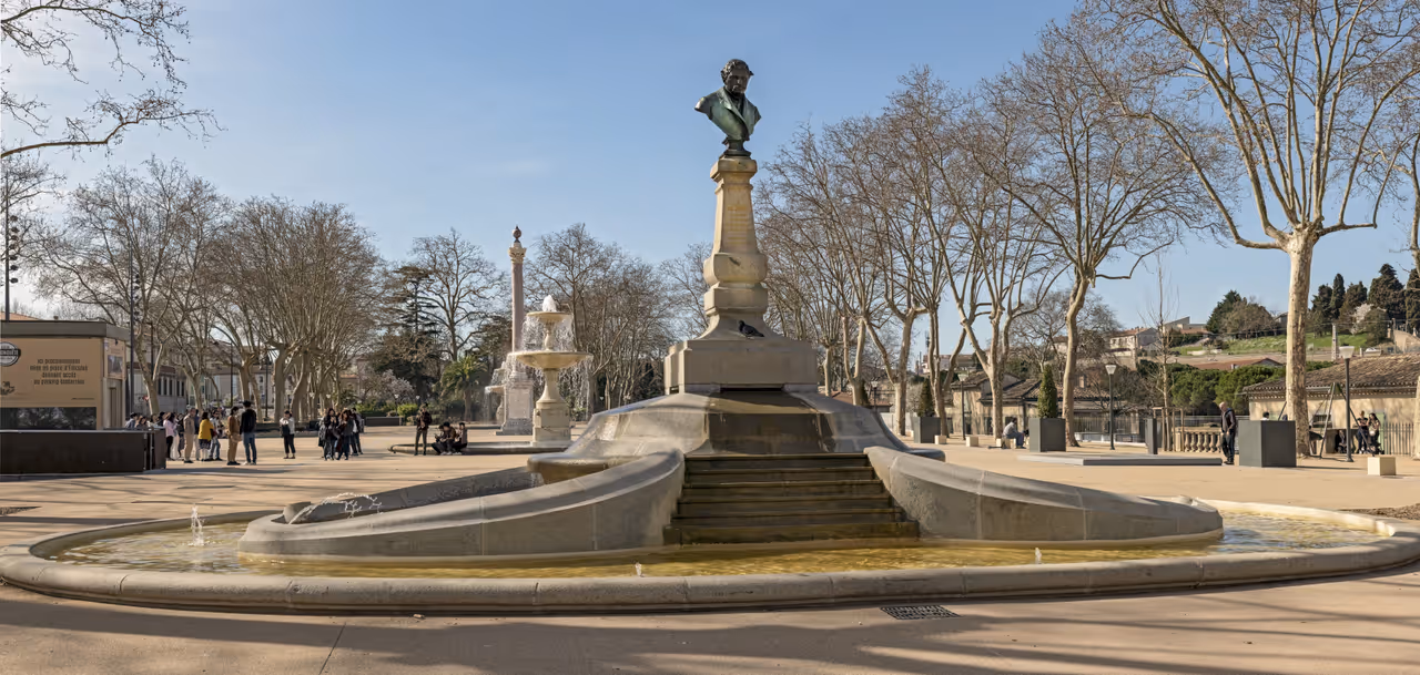 Monument to Omer Sarraut inside a stone fountain at Square Andre Chenier