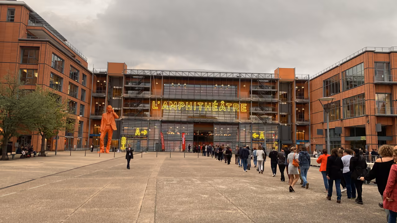 Crowd queueing outside L'Amphithéâtre entrance at Espace 3000 for the Lumière Film Festival award ceremony