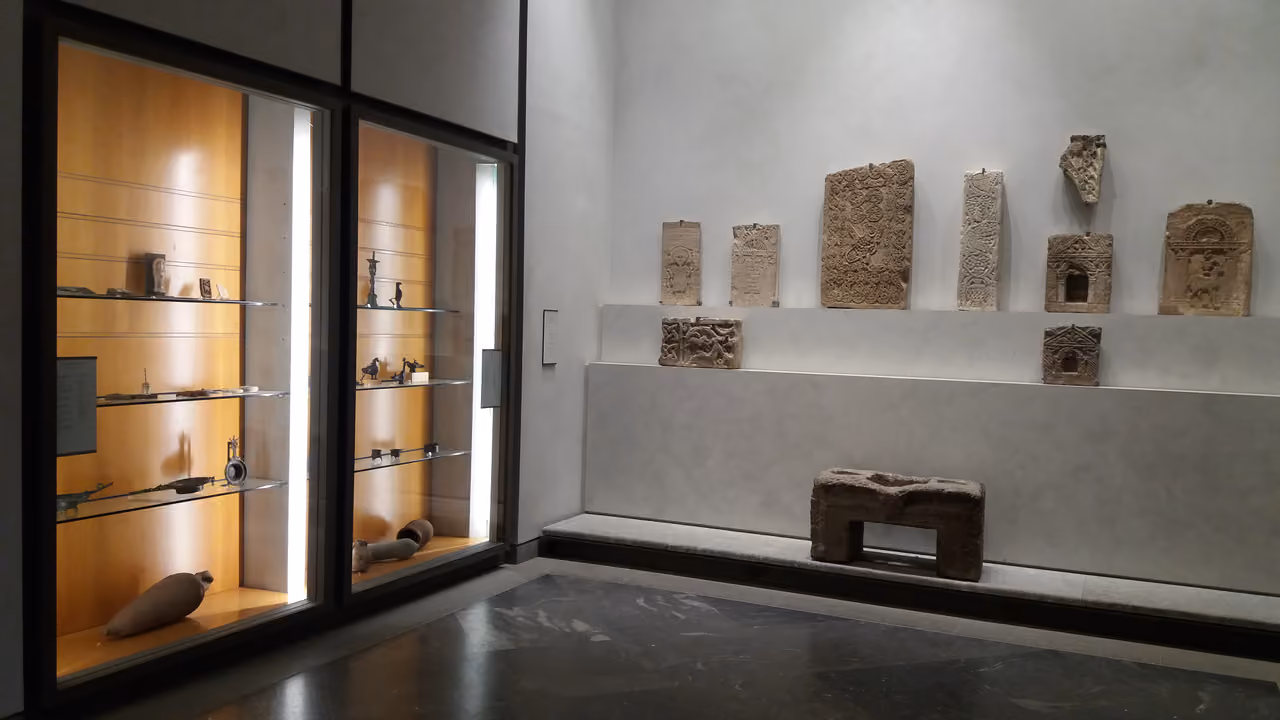 Ancient Egyptian and Roman Empire antiquities room display inside a museum of fine arts