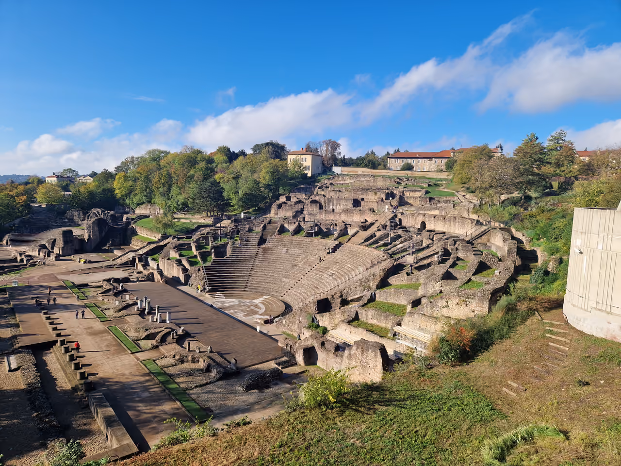 Ancient Roman theatre and odeon ruins viewed from above