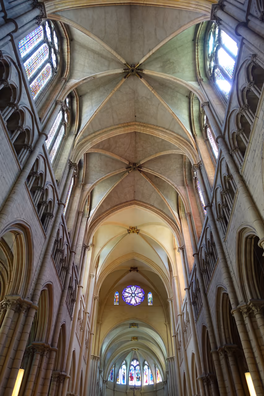Interior view of the Gothic vaulted ceiling and nave of Saint-Jean-Baptiste Cathedral