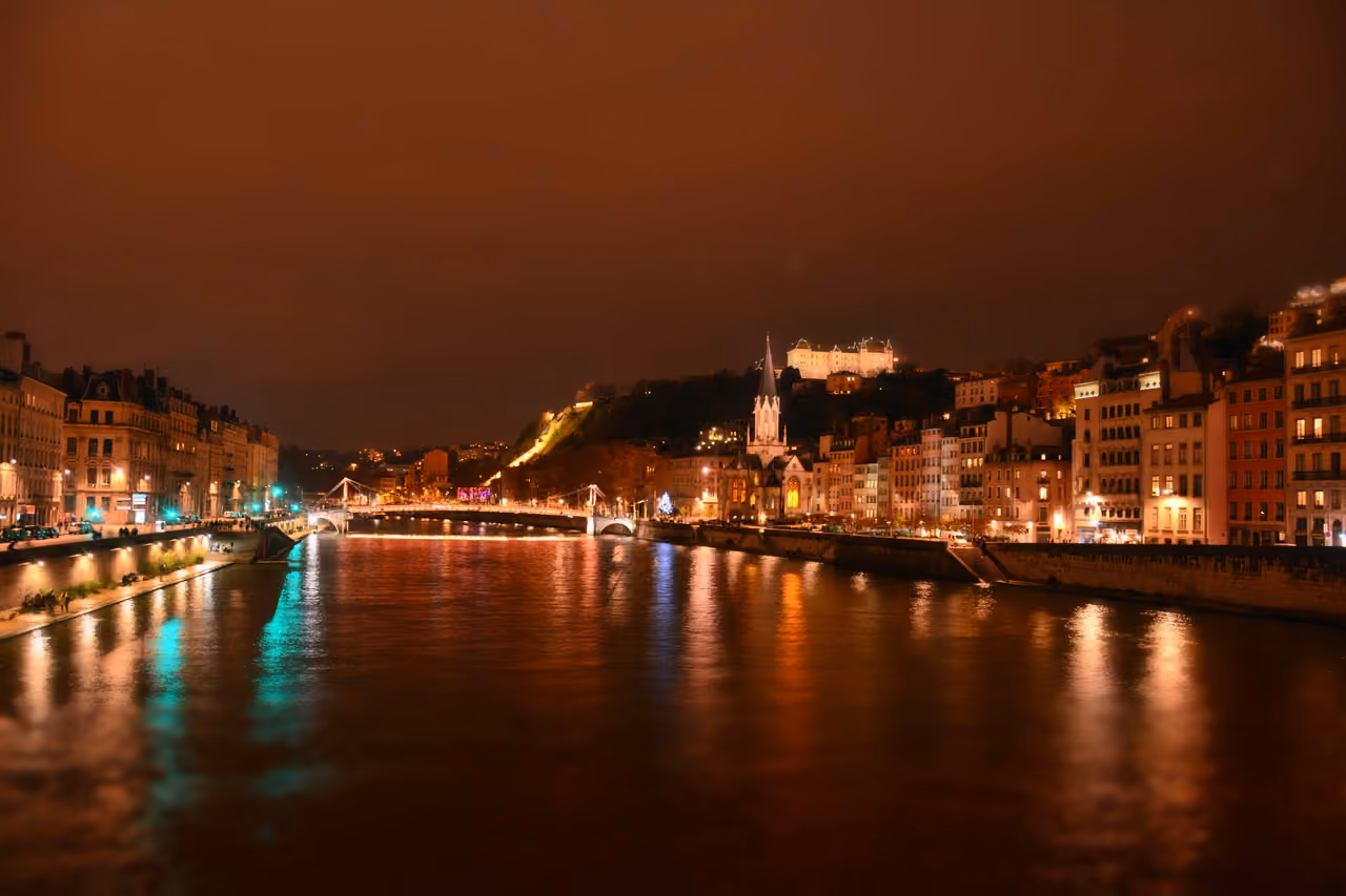Night view of Saint Georges Church and footbridge over the Saone River in Lyon