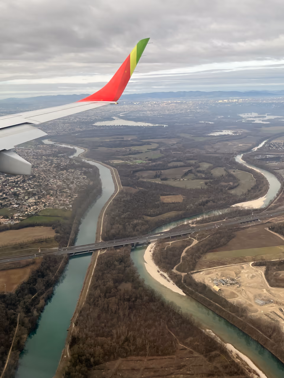 Aerial view of the Miribel and Jonage canals from an airplane window