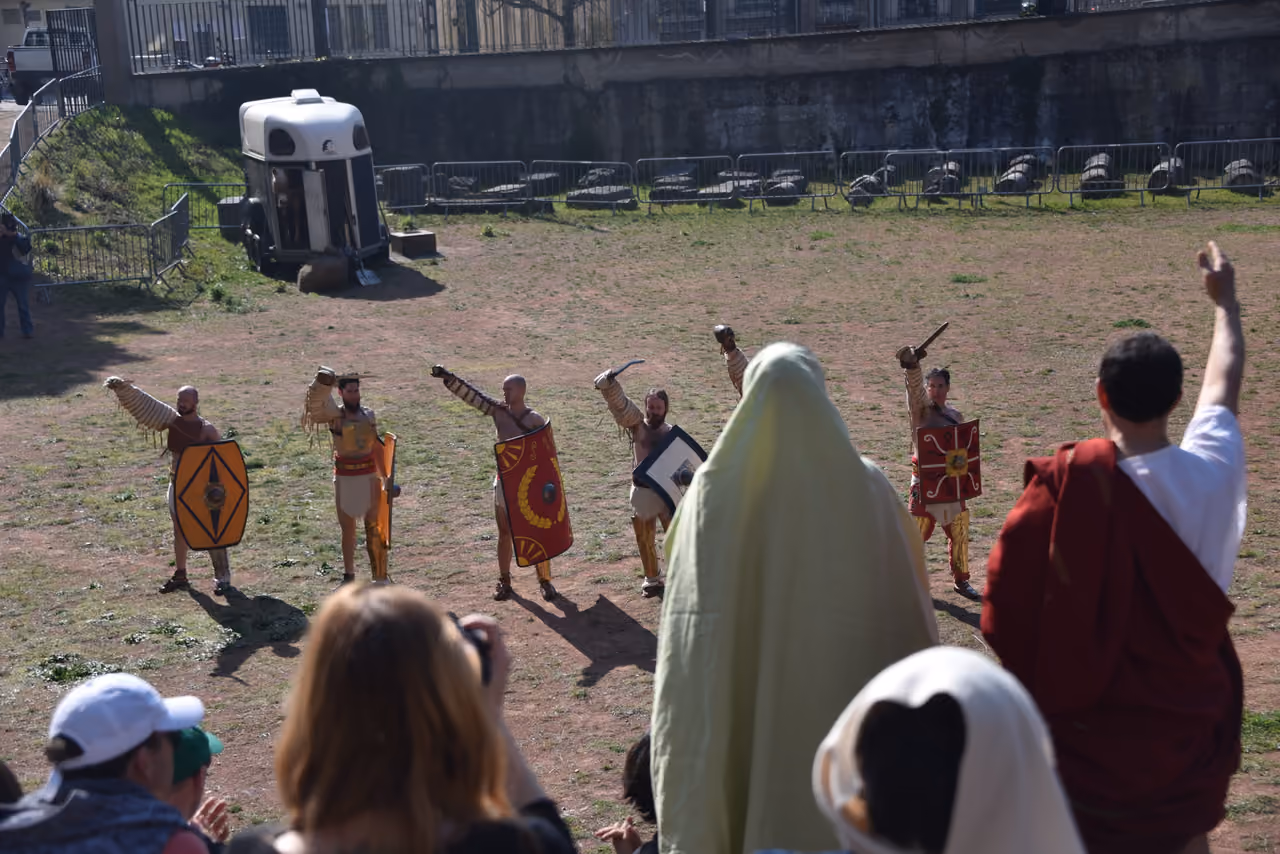 Re-enactment of Roman gladiators saluting the crowd during the European Festival of Latin and Greek
