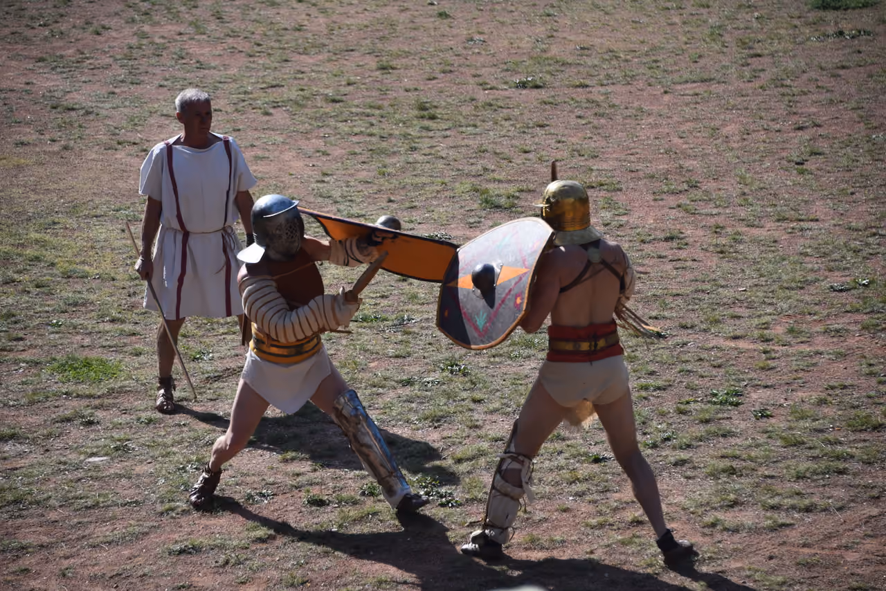 Two gladiators reenacting an ancient Roman sword fight during a historic festival