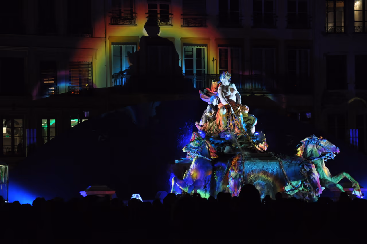 Bartholdi Fountain illuminated during the Festival of Lights in Place des Terreaux