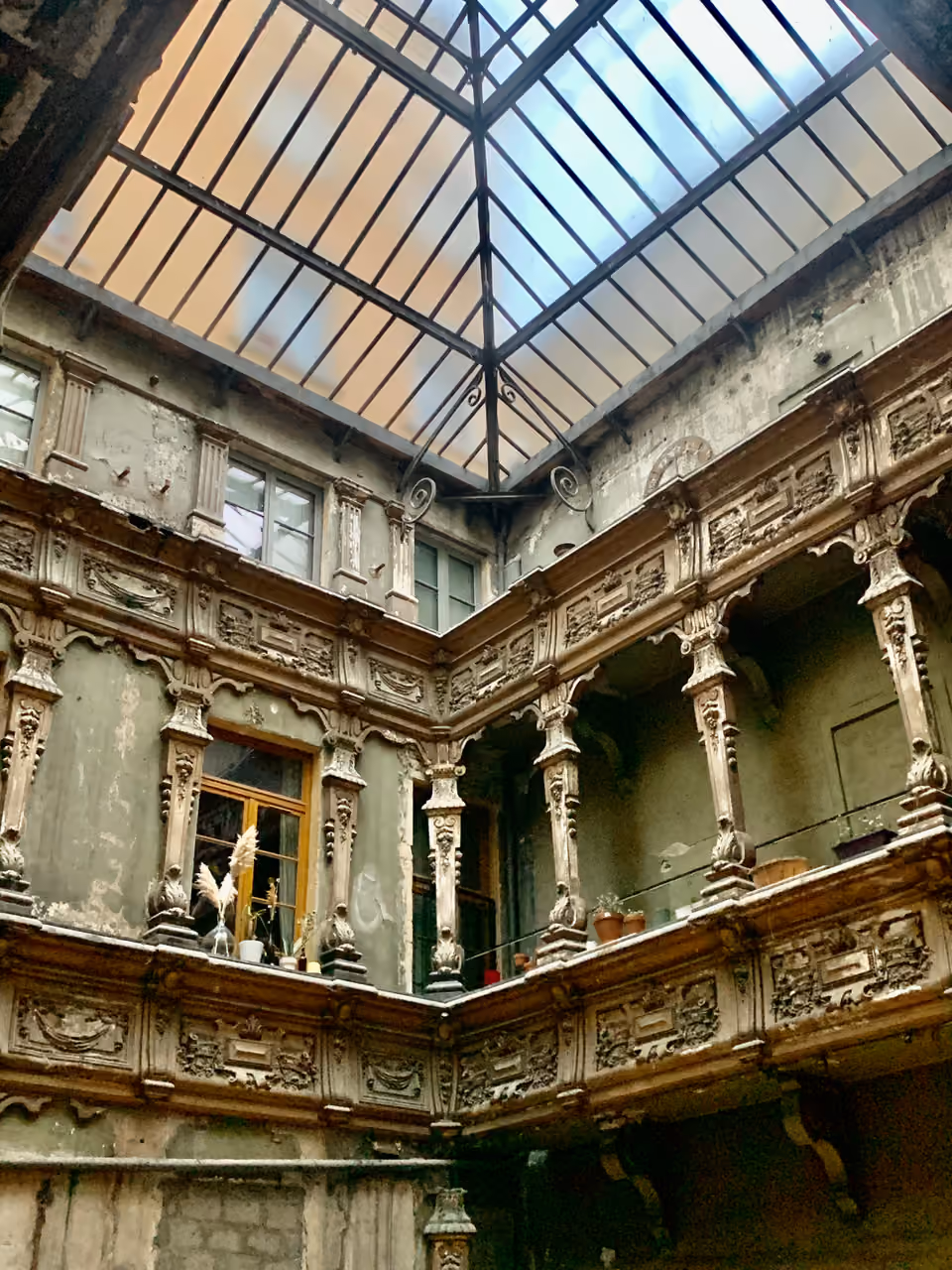 Historic inner courtyard and glass roof of the former Hotel de Milan at Place des Terreaux