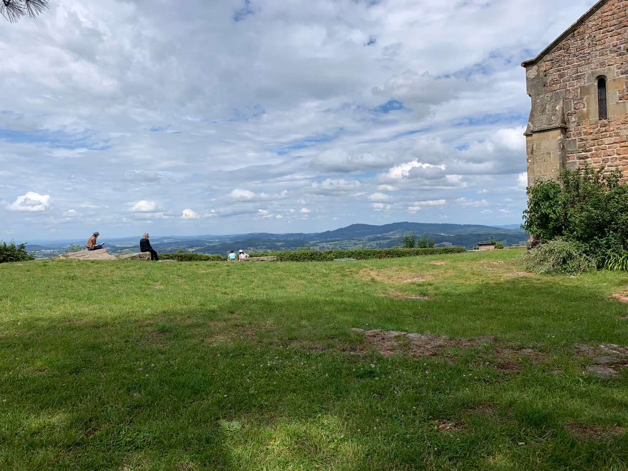 Panoramic view of the rolling green hills and countryside from the summit of Montagne de Dun in Varennes-sous-Dun