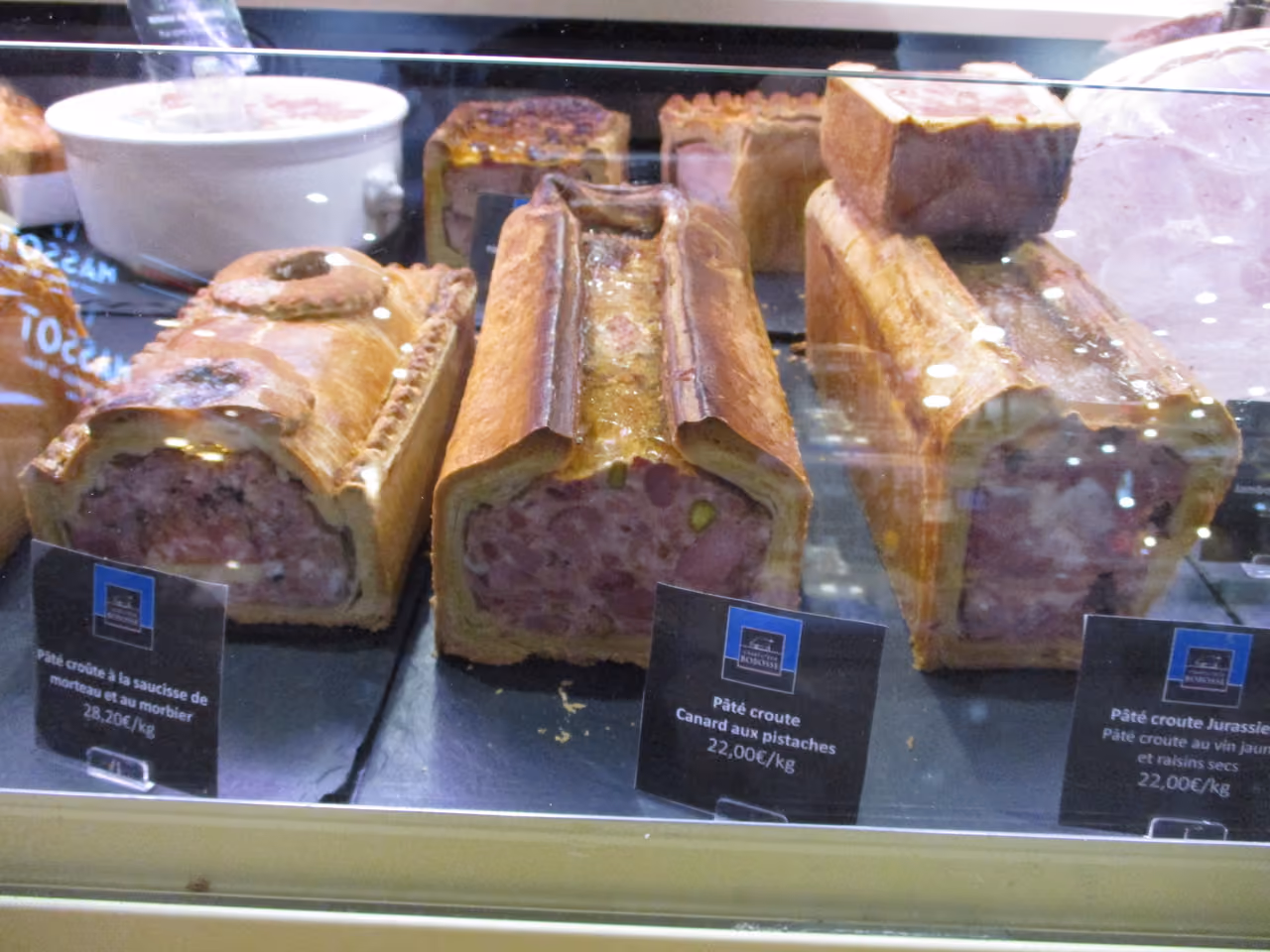 French gourmet pâté en croûte varieties on display at Halles de Lyon Paul Bocuse food market
