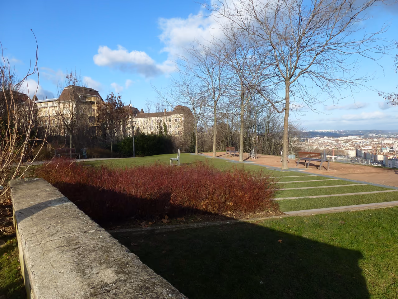 Jardin des Curiosités scenic overlook park with benches and city panoramic view