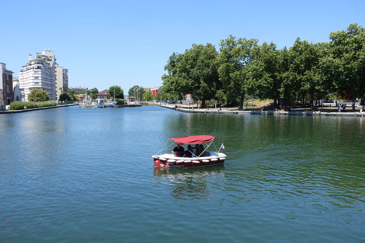 People on a boat in Parc de la villette in Paris