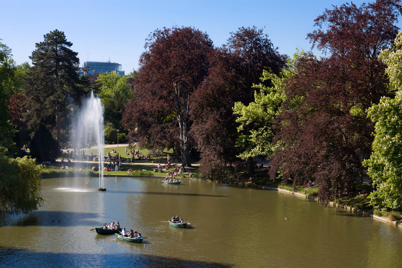 Lake in Orangerie Park, people on small boats, Strasbourg