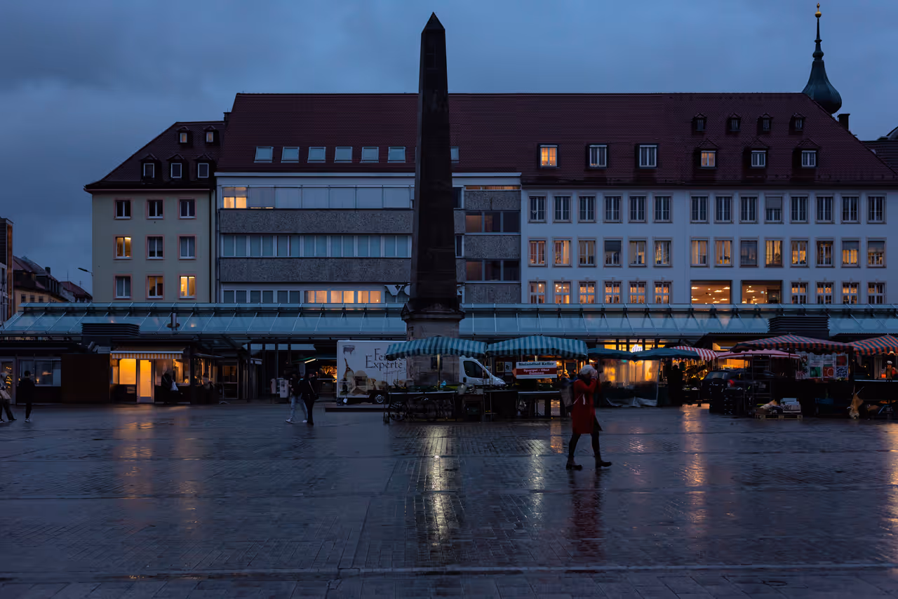 The market fountain in Würzburg after sunset
