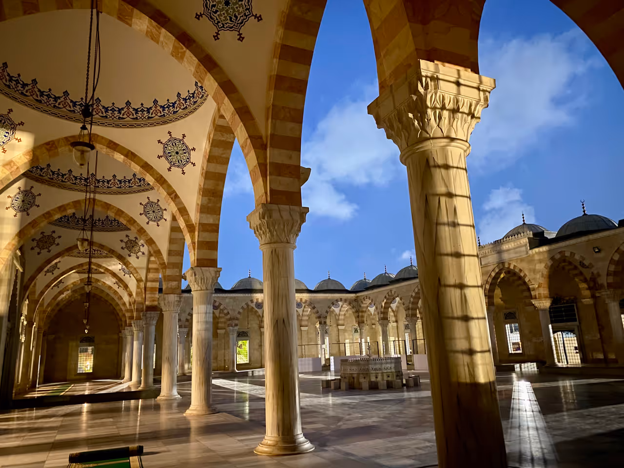An exterior corridor of Ghana national mosque at night
