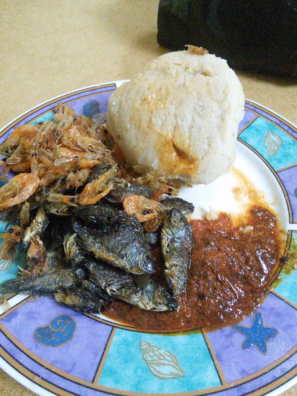 Kenkey and fried fish food in Accra