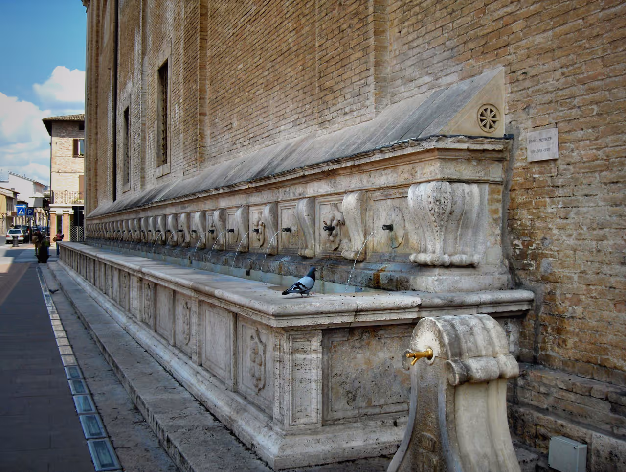 Medici fountain (16th-17th century) at the side wall of the Basilica of Santa Maria degli Angeli