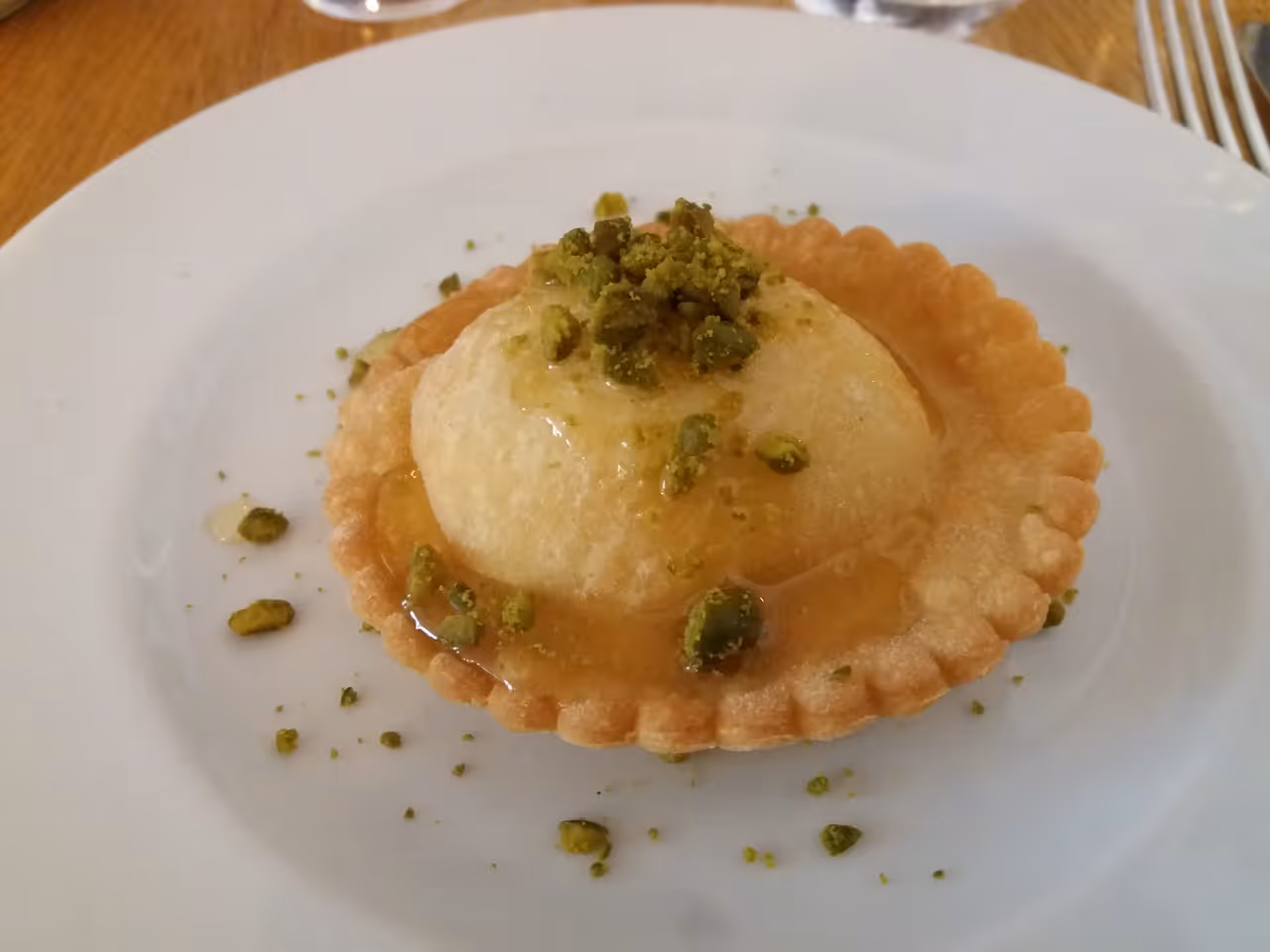 Honey-drenched cheese pastry food in Cagliari