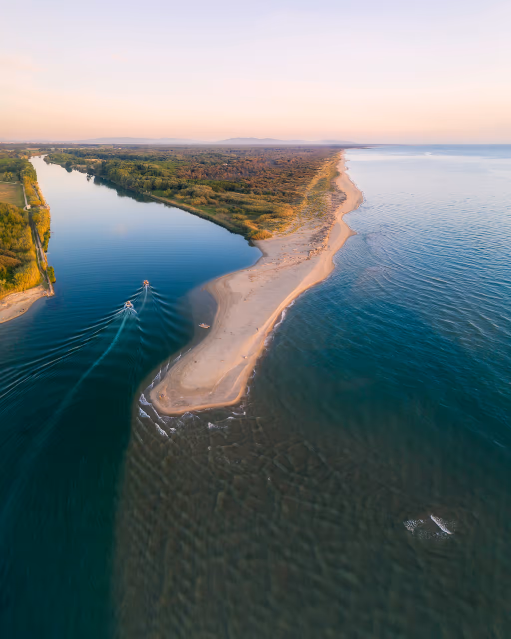 Aerial picture of the mouth of the Serchio river, with the peninsula of the seagulls in the foreground