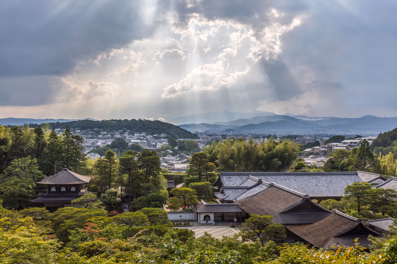 Sunlight through clouds and lookout view of Ginkaku-ji in Kyoto