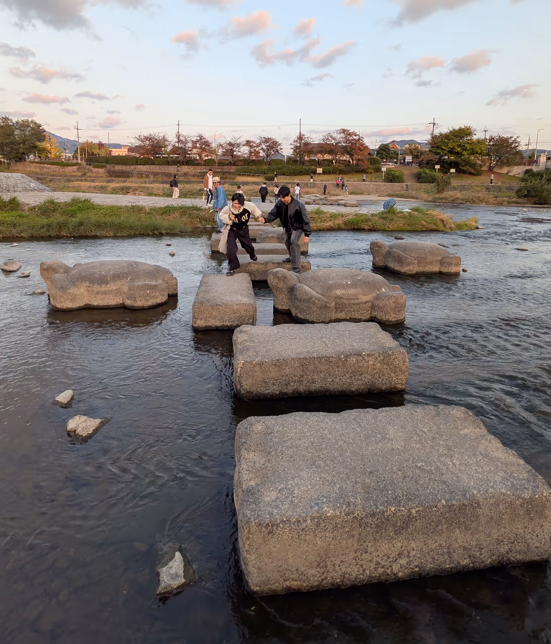 Kamogawa stepping stones free activity in Kyoto
