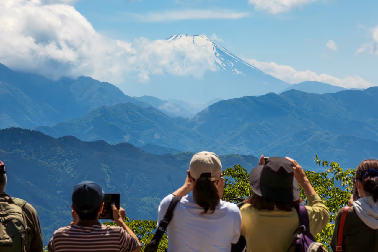 People gazing at Mount Fuji from Mount Takao