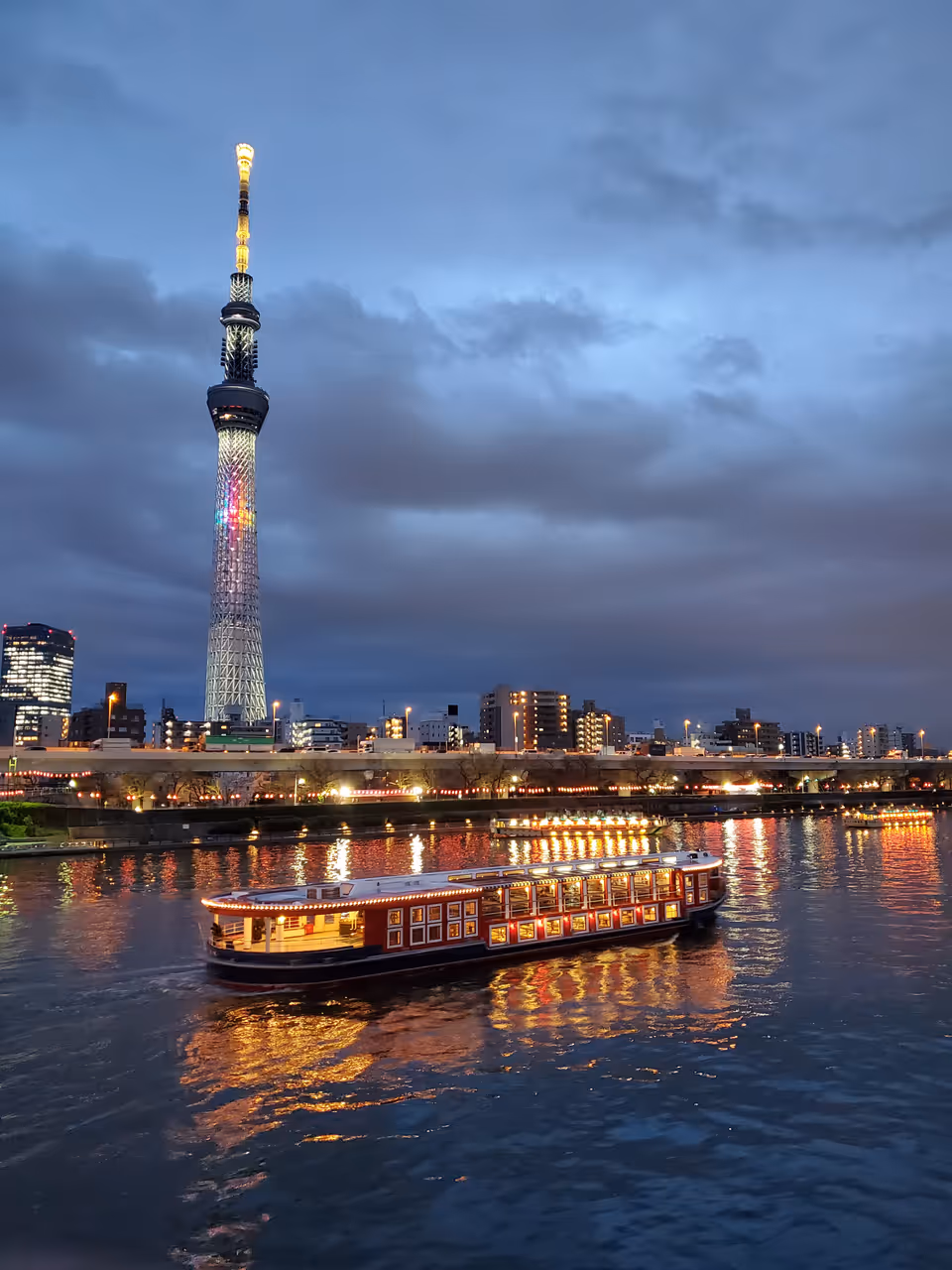 Yakatabune dinner cruise boats on the Sumida River in the evening, Tokyo