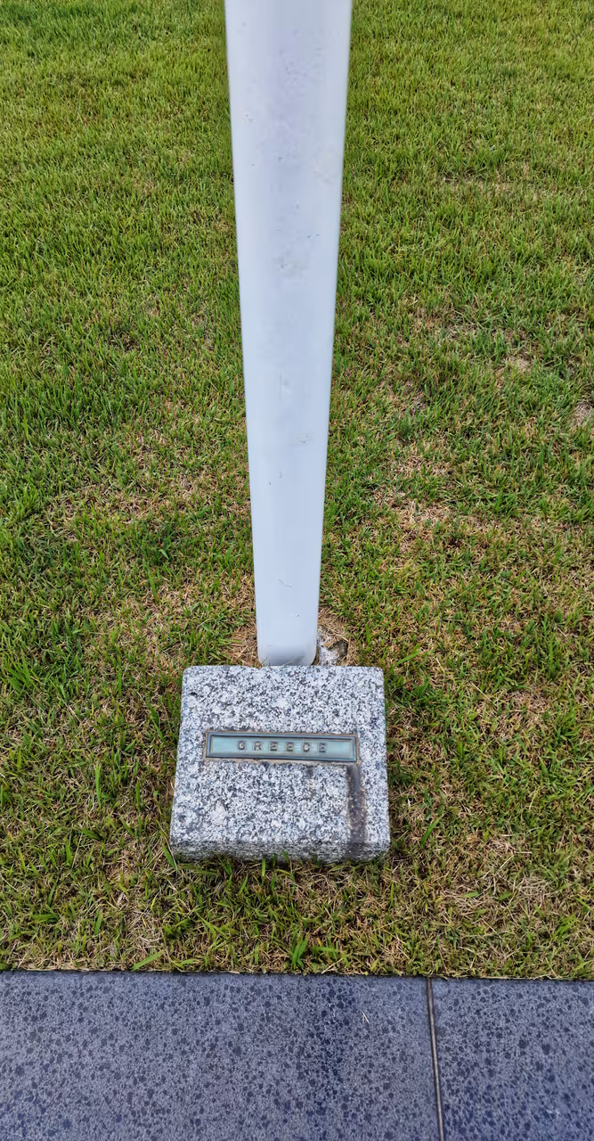 Greece flag base at the UN Memorial Cemetery in Korea, Busan