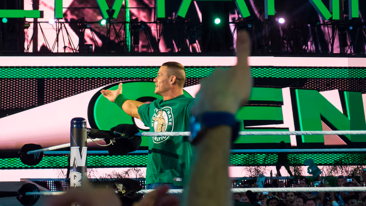 Wrestler John Cena standing in a green ring during Wrestlemania XXVIII