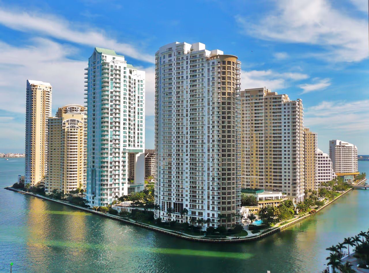 Aerial view of luxury high-rise condominium buildings on Brickell Key waterfront in Miami, Florida