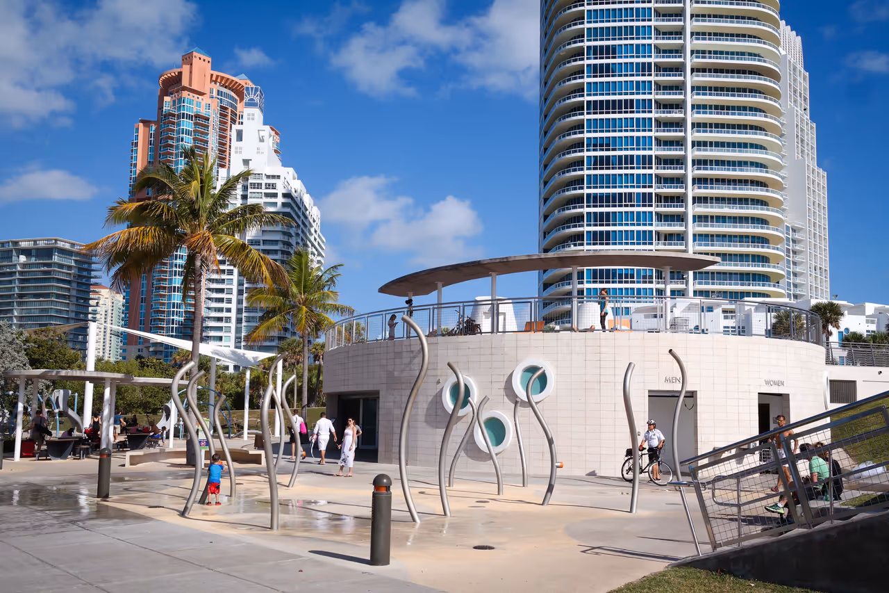 A scenic view of the modern architecture, skyscrapers and water splash park at South Pointe Park in Miami Beach, Florida