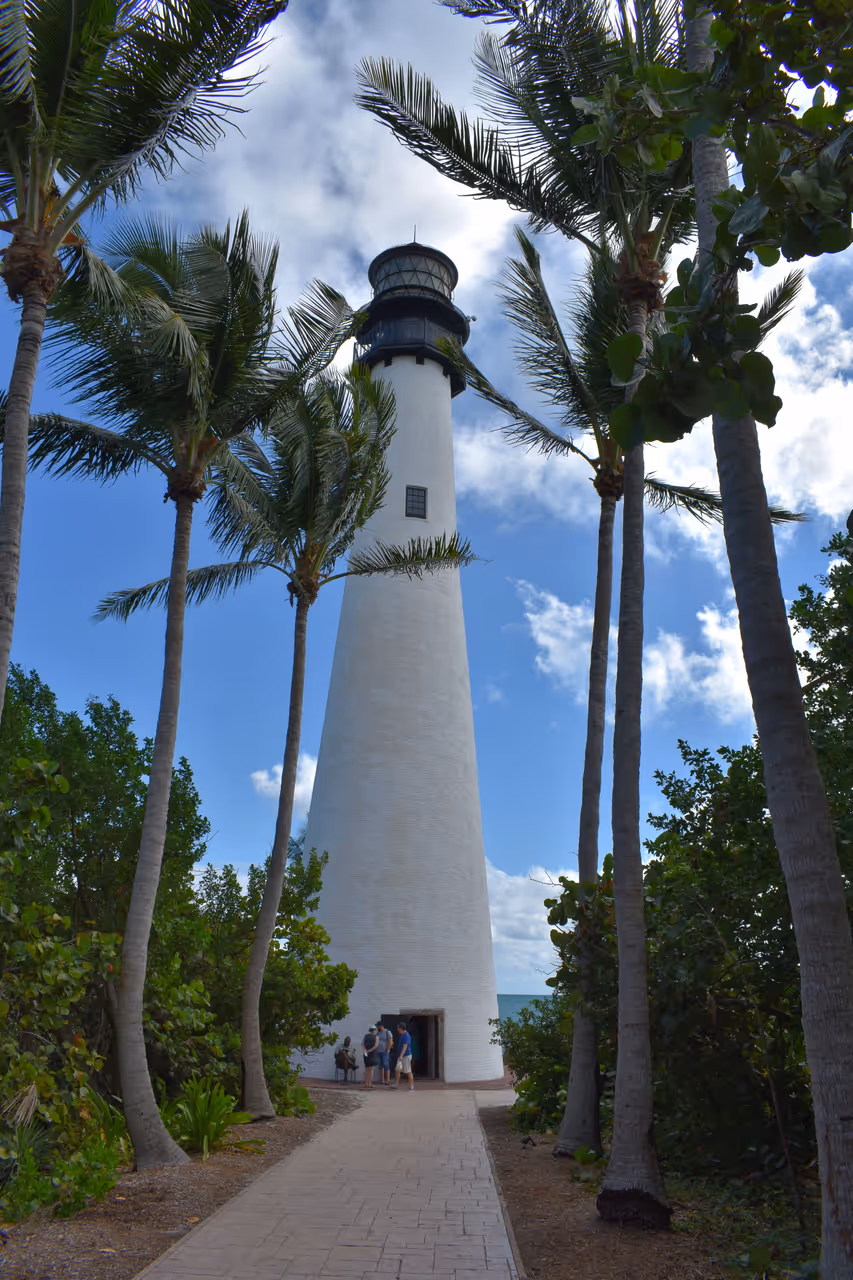Cape Florida Lighthouse surrounded by palm trees at Bill Baggs Cape Florida State Park on Key Biscayne, Florida
