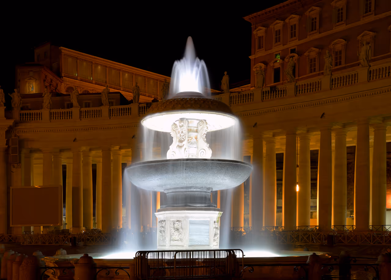 The ancient fountain of St. Peter's Square at night